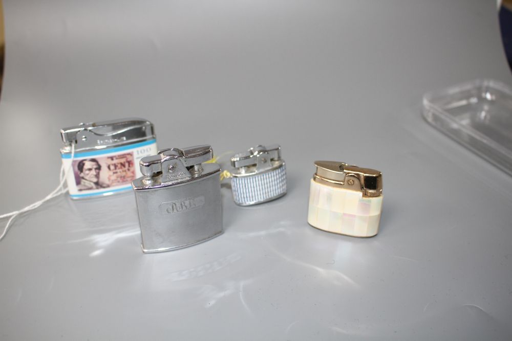 Four assorted ladys and gentlemans base metal cigarette lighters including Ronson mother of pearl and Brother-Lite, largest 55mm.